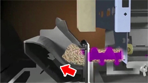 3.オーガ終端に溜まったペレットはさらに後ろからきたペレットに押されまとまって燃焼部へ